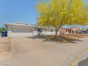 Single-story home showcasing a wide driveway and xeriscaped front yard at 525 Engel Ave, Henderson, NV 89011