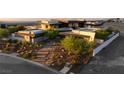 Modern home with desert landscaping and a stone pathway to the entrance at 6 Vista Crescent Ct, Henderson, NV 89012