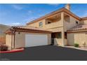 Well-maintained two-story home featuring a garage and a neatly paved driveway for easy parking at 6916 Dorita Ave # 101, Las Vegas, NV 89108