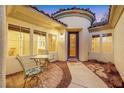 Cozy front patio with seating area, perfect for relaxing outdoors at 7307 Lansbrook Ave, Las Vegas, NV 89131