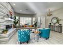 Bright living room with tiled fireplace and bay window at 8969 Rivers Edge Dr, Las Vegas, NV 89117