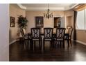 Formal dining room with hardwood floors, chandelier, and elegant furnishings at 9012 Alpine Peaks Ave, Las Vegas, NV 89147