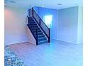 Well lit staircase with wood and carpet design at 95 Palm Park Ct, Las Vegas, NV 89183