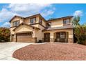 Charming two-story home featuring a well-manicured yard and inviting front porch at 9604 Windom Point Ave, Las Vegas, NV 89129
