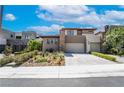 Contemporary home with well-maintained landscaping, a two-car garage, and a neutral color palette at 10313 Jade Point Dr, Las Vegas, NV 89135