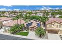 Nevada home featuring solar panels surrounded by lush landscaping in a well-kept neighborhood at 1324 European Dr, Henderson, NV 89052