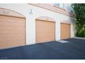 Close-up of multiple garage doors showcasing unit numbers and reserved parking at 1830 N Buffalo Dr # 1031, Las Vegas, NV 89128