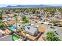 Aerial view showcases the single-story home nestled in a community with a pool at 3118 Floral Vista Ave, Henderson, NV 89014