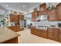 Spacious kitchen with granite countertops, stainless steel appliances, and ample cabinet space at 3614 Coventry Gardens Dr, Las Vegas, NV 89135