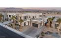 Spacious modern home with multi-car garage, desert landscaping, and great curb appeal set in a residential area at 4024 Desert Trace Ct, Las Vegas, NV 89129