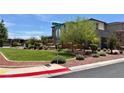 Corner lot showing the beautifully landscaped yard of the house at 4132 Ancient Well Ct, Las Vegas, NV 89135