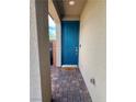 Inviting front door entrance framed by stone pavers and textured walls at 4132 Ancient Well Ct, Las Vegas, NV 89135