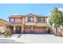 Inviting two-story home featuring a three-car garage and well-maintained front yard at 4133 Perfect Lure St, Las Vegas, NV 89129