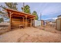 Well-maintained shelter, perfect for horses or livestock, adding functionality to the property at 5081 Riata Pl, Pahrump, NV 89060