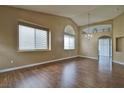 Spacious living room with vaulted ceilings, hardwood floors, and lots of natural light at 5236 Ladyhawk Way, Las Vegas, NV 89118