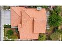 A high-angle shot showcases the red-tiled roof and landscaping of a well-maintained home at 5609 Red Bluff Dr, Las Vegas, NV 89130