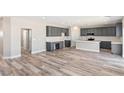 Spacious kitchen with grey cabinets, a kitchen island, and stainless steel appliances at 790 Lone Pine Rd, Pahrump, NV 89048