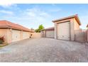 Spacious detached garages offer secure parking, boasting ample driveway space at 8275 W Craig Rd, Las Vegas, NV 89129