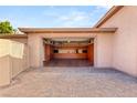 A four-car garage with a workshop space, storage cabinets and a large driveway at 8275 W Craig Rd, Las Vegas, NV 89129