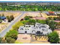 Expansive aerial view of modern home with desert landscaping, solar panels, and picturesque community surroundings at 8525 W Verde Way, Las Vegas, NV 89149