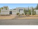 Modern home with desert landscaping, showcasing architectural style and curb appeal at 8525 W Verde Way, Las Vegas, NV 89149