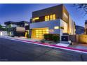 Modern home showcasing an attached two-car garage with glass doors and contemporary exterior design at 917 Vegas View Dr, Henderson, NV 89052