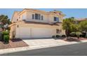 Charming home with tile roof, three-car garage, desert landscaping, and well-maintained exterior at 9491 Gainey Ranch Ave, Las Vegas, NV 89147