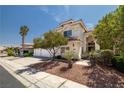 Inviting two-story home featuring a tile roof, three-car garage, and desert landscaping at 9491 Gainey Ranch Ave, Las Vegas, NV 89147