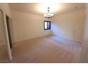The bedroom features neutral carpeting, a window, a closet, and a modern ceiling fan at 9580 W Reno Ave # 183, Las Vegas, NV 89148