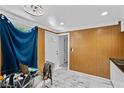 Bright office area featuring tile floors, neutral decor, and a white door at 1004 Yucca Ave, Las Vegas, NV 89104