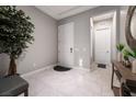 Inviting entryway featuring neutral walls, elegant tile flooring, and stylish decorative accents at 12843 New Providence St, Las Vegas, NV 89141