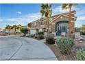 Attractive two-story home with a circular drive and desert landscaping at 131 Beesley Dr, Las Vegas, NV 89110