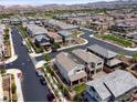 Gorgeous aerial of a Gathering-friendly neighborhood showcasing tidy streets and well-maintained landscaping at 169 Volti Subito Way, Henderson, NV 89011