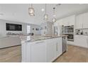 Spacious kitchen with stainless steel appliances, granite countertops, and island seating at 169 Volti Subito Way, Henderson, NV 89011