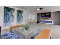 Bright living room with modern decor and entertainment center at 214 Bella Matese Ave, Las Vegas, NV 89183