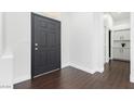Inviting foyer with dark wood floors and freshly painted bright white walls at 2205 Beacon Ridge Dr, Las Vegas, NV 89134