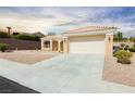 A single-story home featuring desert landscaping, and a two-car garage, on a cul-de-sac at 2205 Beacon Ridge Dr, Las Vegas, NV 89134