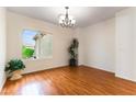 Bright dining room with hardwood floors and natural lighting from large window at 2357 Aztec Ruin Way, Henderson, NV 89044