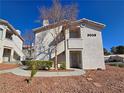 Charming condo with well-maintained landscaping offers a welcoming entrance with a walkway and desert-friendly rock ground cover at 3038 Tarpon Dr # 203, Las Vegas, NV 89120