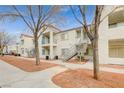 An apartment exterior showcases neutral tones and a well-maintained communal area at 3318 N Decatur Blvd # 2073, Las Vegas, NV 89130