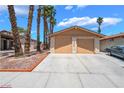 Charming single-story home features a two-car garage, desert landscaping, and a well-maintained front yard at 4498 Via San Rafael, Las Vegas, NV 89103