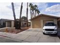 Charming single-story home with a two-car garage, a driveway and desert landscaping at 4498 Via San Rafael, Las Vegas, NV 89103