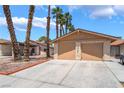 Charming single-story home features a two-car garage, desert landscaping, and a well-maintained front yard at 4498 Via San Rafael, Las Vegas, NV 89103