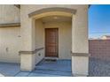 Close-up of the front entrance showcasing a charming covered porch and a modern security system at 4539 Cotton Quail Ave, Las Vegas, NV 89115