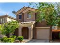 Charming two-story home showcasing a well-maintained exterior with a tile roof and manicured landscaping at 519 Brinkburn Point Ave, Las Vegas, NV 89178