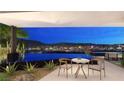 Infinity pool offers breathtaking city views, complemented by stylish outdoor seating at 607 Grand Rim Dr, Henderson, NV 89012