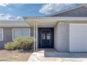 Close-up of the home's front entrance showcasing a secure metal security door and desert landscaping at 720 Sam Jonas Dr, Las Vegas, NV 89145