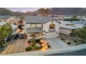 Stunning two-story home features a well-manicured front yard, a two car garage, and a charming front porch at 781 Wigan Pier Dr, Henderson, NV 89002