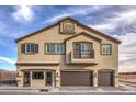 Inviting two-story home showcasing a well-maintained facade, balcony, and three-car garage at 7920 Pandora Sky St # 281, North Las Vegas, NV 89084