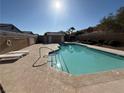 Community pool with clear blue water, ample seating, and meticulous upkeep at 8049 Celestial Ave # 201, Las Vegas, NV 89128